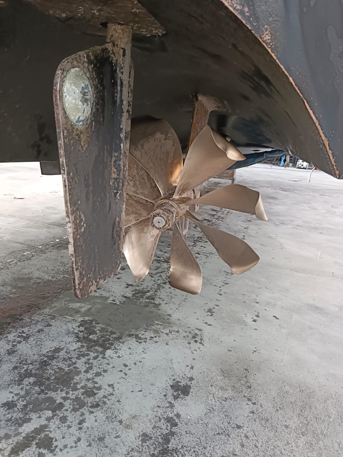 Propeller and rudder under a hull on the slipway