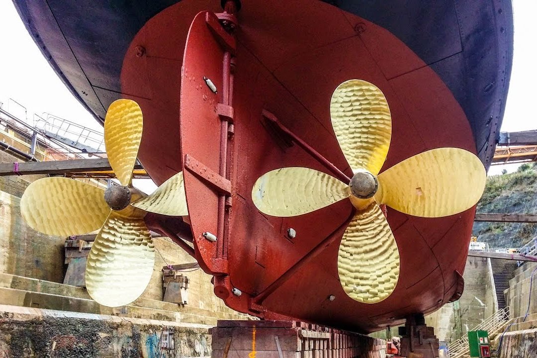 Twin propellers under a hull in dry dock